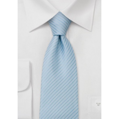 Electric blue necktie with fine stripes