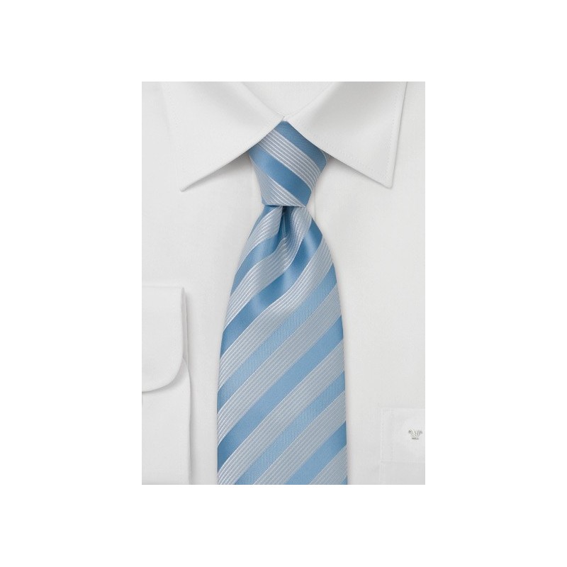 Light blue tie with ribbed white stripes