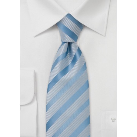 Light blue tie with ribbed white stripes