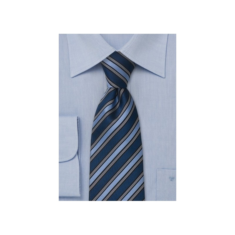 Navy blue, light blue, and gray striped silk tie
