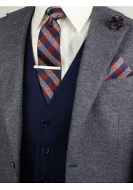 Matching burgundy plaid necktie and pocket square