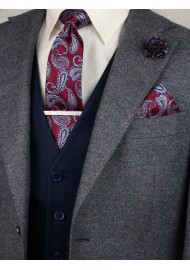 Matching burgundy paisley necktie and pocket square